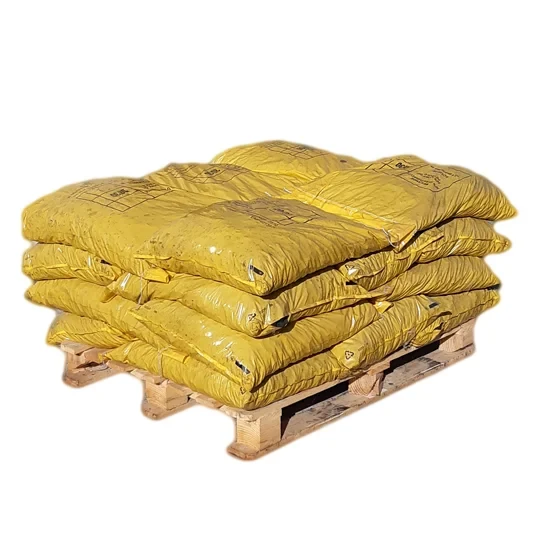 Real DENVA product photograph of yellow anthracite bags stacked on a pallet.
