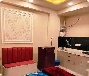 Kitchenette and cushioned seating in the supplied GUDVELA property gallery
